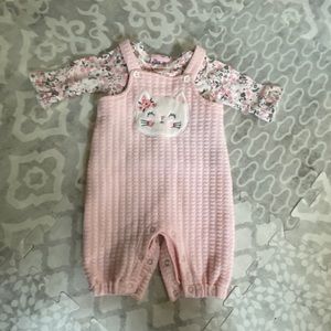 Pink overalls and floral shirt